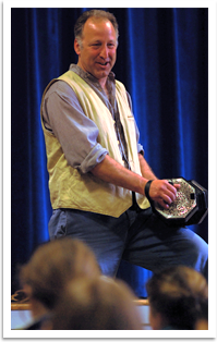 David Coffin playing the concertina at a school performance